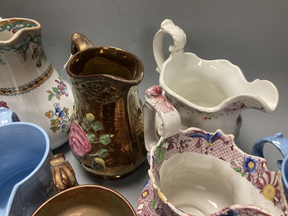 A collection of eleven lustre jugs and a mug, tallest 21cm